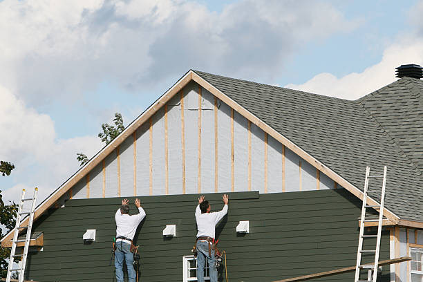 Professional Siding technician working in Centerport, NY
